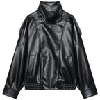 Front flat lay of the black oversized cropped moto jacket showing the asymmetric placket, epaulette straps and elasticated hem