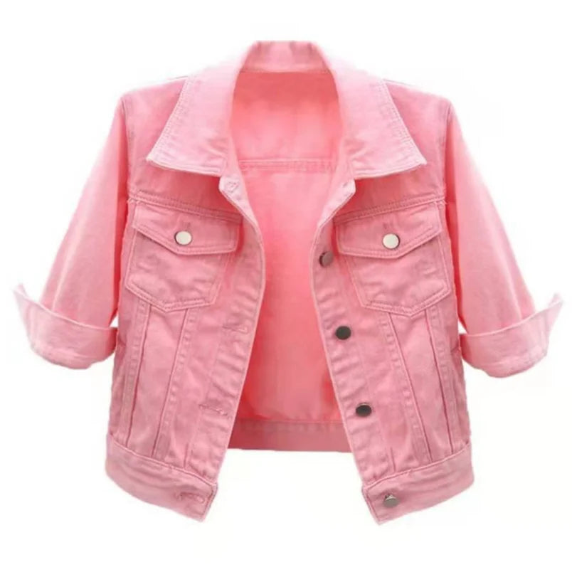 Cropped pink denim jacket with spread collar, snap button front and rolled cuffs, shown hanging open